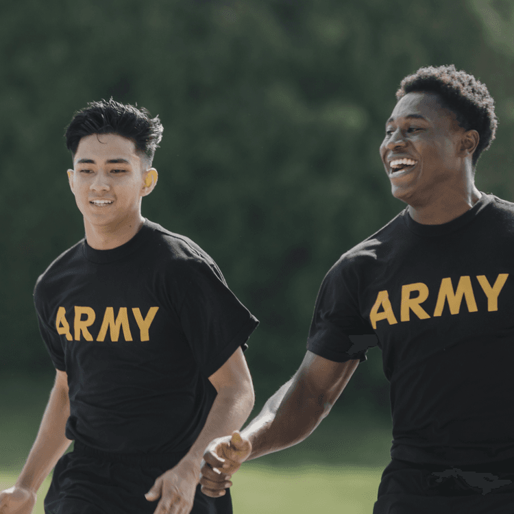 Two smiling soldiers in PT gear run together during Army fitness test.